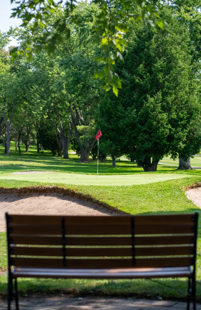 Photo of a bench looking over a chipping green